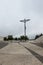 Square in front of the Rosary Basilica in the Marian shrine with a large modern cross in Fatima