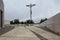 Square in front of the Rosary Basilica in the Marian shrine with a large modern cross in Fatima