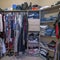 Square Full organized walk in closet with open wardrobe and carpeted flooring