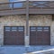 Square Garage door under the balcony of a snowy home in Park City Utah neighborhood