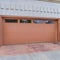 Square Garage of house in San Diego california with glass panes on the wide brown door