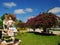 square with a garden of exotic flowers and sculptures of water fountain figuresand The St. James Cathedral main