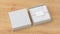 Square gift box mock up. White gift box with blank label or business card on wrapping paper. CCC background. Side view