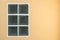 Square glass block windows on orange cement wall texture background