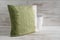 Square Gradient Green Throw Pillow and Empty Vase