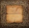 A square grapevine wreath on a wooden background