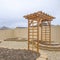 Square Heart shaped planting beds and wooden arbor at the yard of a home