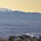 Square Hill homes with distant snow capped mountain toweing over lake and valley