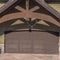 Square Home in Park City Utah in winter with gabled garage entrance against blue sky