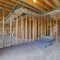 Square House interior under construction with air conditioning ducts on the ceiling