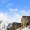 Square Houses built on top of a mountain blanketed with snow in winter