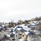 Square Houses on residential hill in Park City Utah with snow dusted slopes in winter