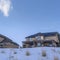 Square Houses surrounded by sweeping views of snow covered Wasatch Mountain landscape