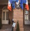 Square image of city hall male worker at the entrance to polling station