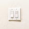 Square Indoor multiple rocker light switch with broad flat levers and cover plate