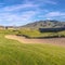 Square Long meandering sand trap on a golf course