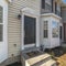 Square Long row of wooden urban townhouses day light