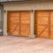 Square Luxurious exterior of a house with stylish brown wooden garage doors