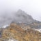 Square Misty clouds over the rugged peak of rocky mountain in Provo Canyon Utah