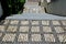 Square mosaic pattern with white marble staircase. the dice are smoothed by the shoes with long use. stairs ramp between houses