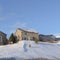 Square Mountain homes of Wasatch Mountains against blue sky on a sunny winter day