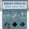 Square Pet Waste Station with black dog poop bags against blurry homes and snowy ground