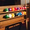 Square photo Set of balls for a game of pool billiards on shelve