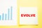 Square piece of paper for office business notes with the word EVOLVE