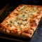 Square pizza with cheese, ham, spices. Dark background. Side view