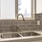 Square Polished kitchen countertop with double basin stainless steel sink and faucet