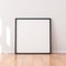 Square Poster with Black wooden Frame Mockup standing on the floor