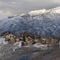 Square Pristine landscape of Wasatch Mountains with houses on its snow covered terrain