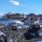 Square Pristine Wasatch Mountain landscape with houses on sweeping snowy terrain