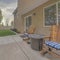 Square Puffy clouds at sunset Relaxing patio with two wooden rocking chairs on a concrete slab