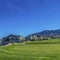 Square Residential area on a valley with view of mountain under blue sky and bright sun