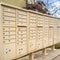 Square Residential mailboxes with numbered compartments on the side of a road