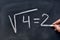 Square root written on a blackboard