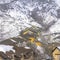 Square Rows of snowy houses built on the frosted slope of Wasatch Mountains in winter