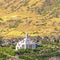 Square Salt Lake City Utah suburbs with a white temple towering over houses and roads