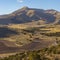 Square Scenic panorama of a mountain against light blue sky on a sunny day