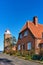 Square-shaped Svaneke Lighthouse on the coast of Baltic Sea in Svaneke.