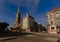 Square with shops, residential buidings and church in the city of Antwerp