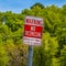 Square Sign that reads Warning No Trespassing Ogden City Police Letter Of Agency