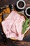 Square Sliced pork meat ham on plate. Wooden background. Top view