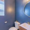 Square Small bathroom interior with blue violet walls and gold fixtures
