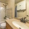 Square Small traditional bathroom interior with wall cabinets and over-the-toilet storage