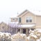 Square Snowy home and frosted foliage on a scenic neighborhood landscape in winter