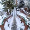 Square Stairs amid neighborhood and scenic hill blanketed with white snow in winter