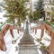 Square Stairway on hill overlooking rooftops homes and trees with fresh snow in winter