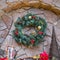 Square Stone wall decorated with enchanting Christmas ornaments and warm lights